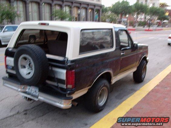 Ford Bronco parked on street, spare tire on back