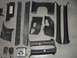 1994 Ford Probe - A collection of disassembled interior car parts are laid out on a gray surface.