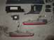 1994 Ford Probe - Various disassembled car components are arranged on a flat surface, suggesting repair or replacement.
