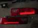 1994 Ford Probe - Pair of car taillights and an electronic control module, likely for replacement or repair.