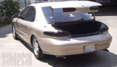 1998 Mercury Sable rear view, trunk open, tan paint