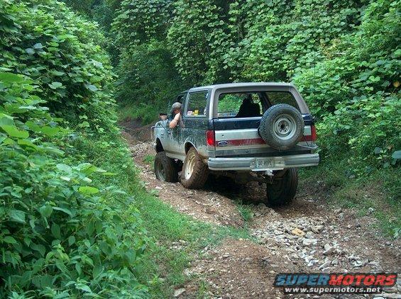 1989 Ford Bronco rear view, off-roading on a rocky trail