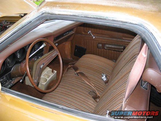 1974 Ford Ranchero interior with striped cloth seats and brown dashboard