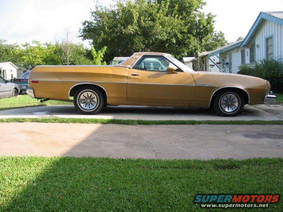 Gold Ford Ranchero parked in a driveway. It has a long bed and a two-door cab