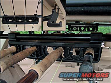 Interior shot of fishing rod holders mounted to the ceiling of a vehicle
