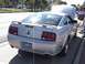 1968 Ford Mustang - A silver coupe is parked with its hood up, viewed from the rear.