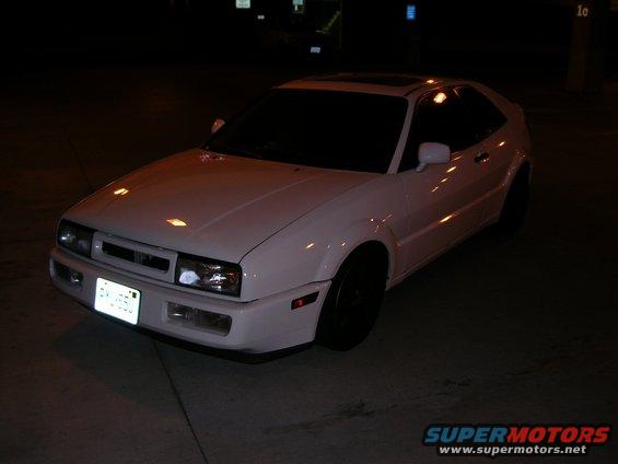 White 1990 Volkswagen Corrado parked at night