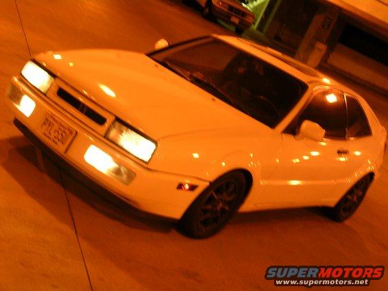 White 1990 Volkswagen Corrado parked at night