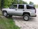 2000 Chevrolet Tahoe - This 2000 Chevrolet Tahoe is captured in a side profile while navigating an off-road terrain.