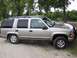 2000 Chevrolet Tahoe - Side view of a silver 2000 Chevrolet Tahoe SUV parked outdoors.