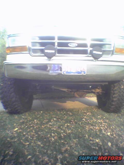 1993 Ford Bronco front grille, headlights, and bumper with auxiliary lights. License plate visible