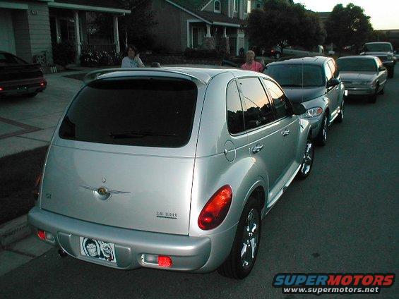 Silver 2004 Chrysler PT Cruiser parked on street, other cars behind it