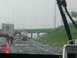 1988 Ford Bronco - A rainy day traffic jam on the highway, seen from inside a vehicle.