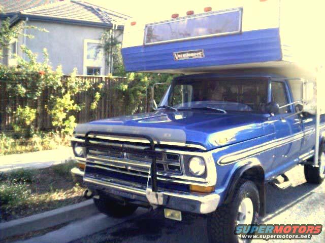Blue 1971 Ford F-250 with camper shell, 3q-front view