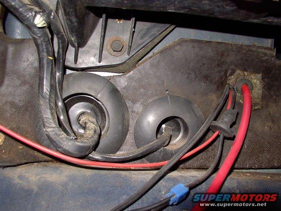 img_0054.jpg Here is the 4 gauge wire to the amps coming in through the firewall (properly grommeted to prevent major meltdowns). It's coming from the 60 amp Maxi fuse which is fed from the 175 amp Mega fuse, right off the 130 amp alternator stud.