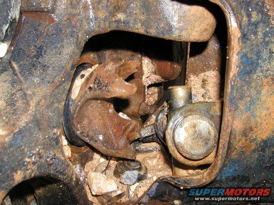 Broken U-joint on rusty vehicle axle