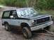 1982 Ford Bronco - This 1980 Ford Bronco is shown in a three-quarter front view while navigating an off-road trail.