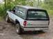 1982 Ford Bronco - 1982 Ford Bronco seen off-road with a sticker on the rear window.