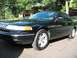 1996 Ford Crown Victoria - Black 1996 Ford Crown Victoria LX Sport parked outside a suburban home.