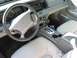 1996 Ford Crown Victoria - Interior view of a 1996 Ford Crown Victoria, highlighting the dashboard and seating.