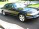 1996 Ford Crown Victoria - A black 1996 Ford Crown Victoria is parked in a driveway with another car visible behind it.