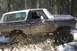 1978 Ford Bronco - This 1978 Ford Bronco is navigating a challenging off-road course with mud and snow.
