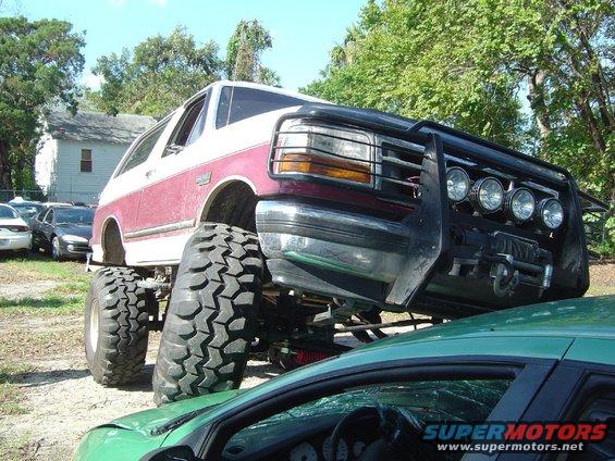 Lifted 1993 Ford Bronco with large tires and brush guard