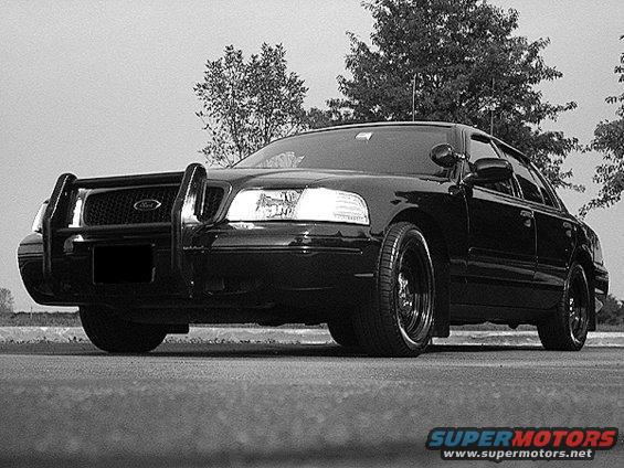 Black 2000 Ford Crown Victoria with a push bar, front view