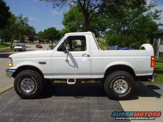 White 1993 Ford Bronco lifted on BFGoodrich Mud-Terrain T/A tires, side view