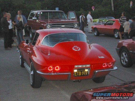 Red 1965 Chevrolet Corvette Sting Ray coupe rear view with California license plate ETB 977