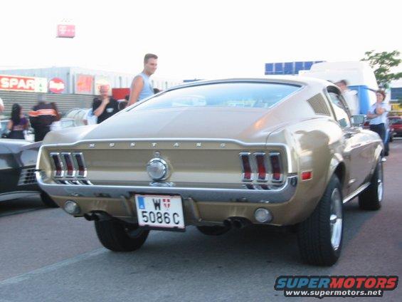 Gold 1967 Ford Mustang fastback rear view. License plate W 5086 C