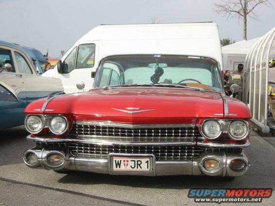 Red 1959 Cadillac Eldorado front view with chrome grille and dual headlights