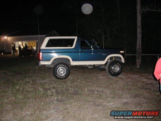 Blue and tan 1985 Ford Bronco, side view
