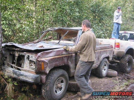 img_2101.jpg New tires installed and roof yanked up high enough so that all could drive the thing.