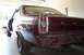 1966 Ford Fairlane - Rear view of a maroon 1966 Ford Fairlane showing the taillight and quarter panel.