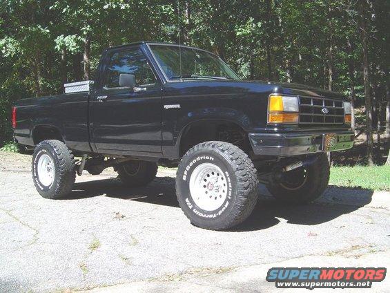 Black 1989 Ford Ranger pickup truck with lifted suspension and off-road tires