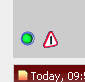Dashboard with green indicator light and red warning triangle with car icon