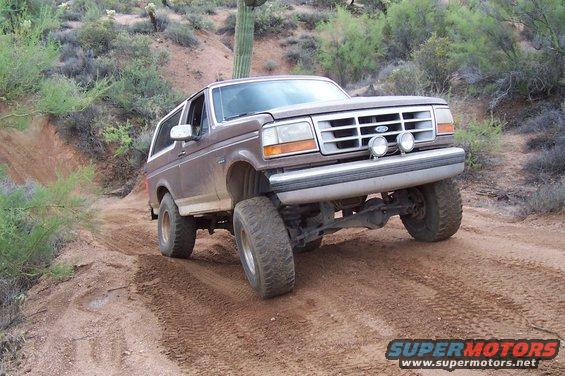 Brown 1992 Ford Bronco on a dirt road
