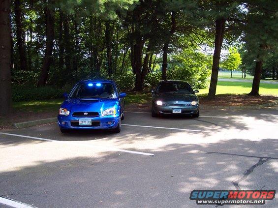 Blue 2004 Subaru Impreza front view with blue dashboard lights