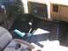 1989 Ford Bronco - Interior view of a car's dashboard, showing the floor shifter and center console.