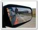 1973 Mercury Cougar - A plane is landing and appears in the reflection of a car's side mirror, which has a warning about object proximity.