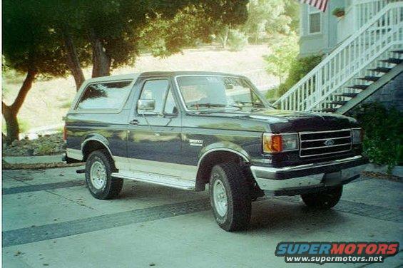 Dark blue and silver 1991 Ford Bronco, 3/4 front view