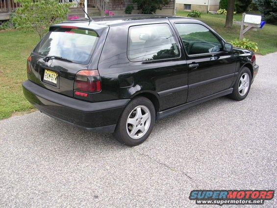 1996 Volkswagen GTI parked on asphalt driveway, rear view