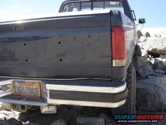 Dark blue pickup truck rear bumper and tailgate with California license plate 3G82043