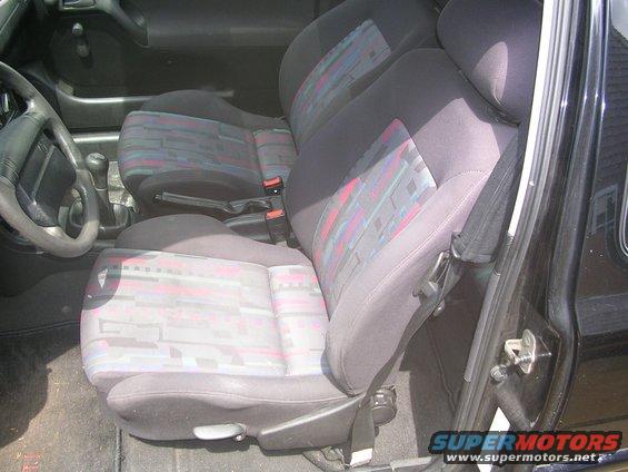1996 Volkswagen GTI interior with patterned cloth seats and manual gear shifter