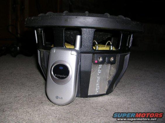 U.S. Audio subwoofer next to an LG flip phone