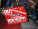1986 Ford Bronco - A red Lincoln Electric welding machine is labeled 'BIG HI-PERFORMANCE BRONCO' and sits on a storage container.