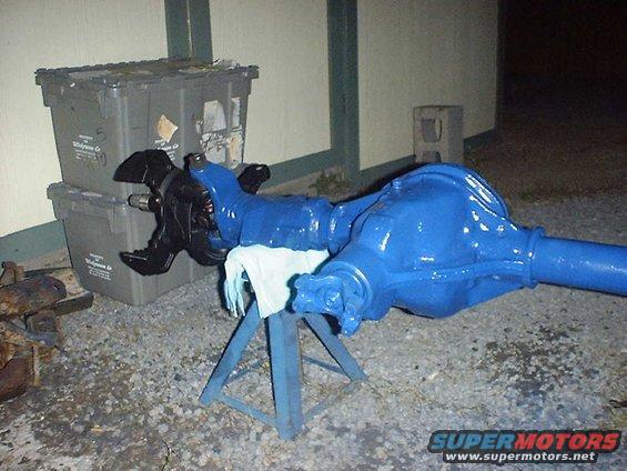 Blue painted front axle assembly on stand