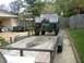 1995 Ford Bronco - This off-road vehicle, possibly a Ford Bronco, is seen from the rear while loaded onto a trailer.
