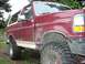 1993 Ford Bronco - This lifted Ford Bronco has aggressive off-road tires and a custom sticker on the windshield.